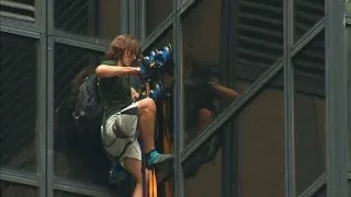 Man seen scaling Trump Tower with suction cups