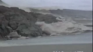 Ilulissat, Greenland - Giant rolling Iceberg creates a tsunami like wave