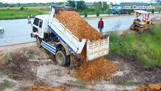 Starting Project Filling Back By Many Dump Truck Unloading Soil- Small Dozer Pushing By Skill Driver