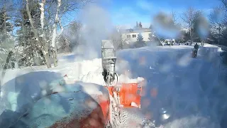 Snowblowing some windblown snowbanks.