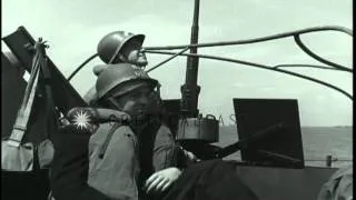 Soldiers seated near a 20mm gun aboard a cutter during the Invasion of Normandy i...HD Stock Footage