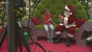 Signing Santa greets deaf children in