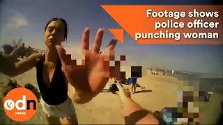 Bodycam footage shows police officer punching woman