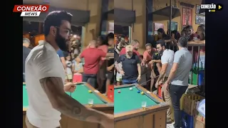 Gusttavo Lima surpreende fãs ao parar em bar para jogar sinuca.