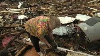 Woman reunited with dog amid tornado wreckage