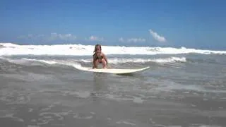 3 Year Old Surfer Girl Waves To The Camera