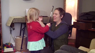 Practicing violin with a 3-year-old child