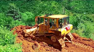 Bulldozer's First Step in Leveling Hills in Extreme Areas to Widen Roads in the Mountains