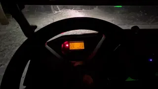 Honda Pioneer 1000 four wheeling in the snow at night