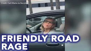 'Sorry, darling!' Friendly road rage incident caught on camera