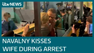 Poisoned Kremlin critic Alexei Navalny kisses wife goodbye as he is arrested | ITV News