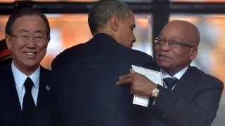 Crowds cheer Obama, heckle Zuma