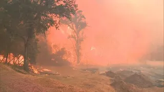 California firefighters scramble to contain wildfires amid high winds