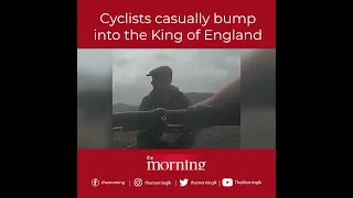 Cyclists casually bump into the King of England