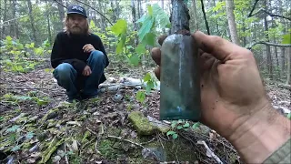 Digging And Collecting Bottles From An Old Mining Dump
