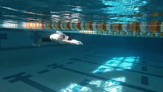 Dolphin kick on back hands in streamline