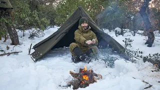 Bushcraft adventure trip in snow with Canvas Lavvu, making efficient grill to grill meat...