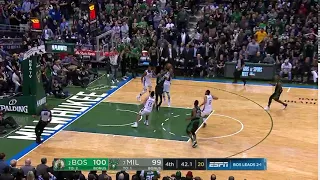 Khris Middleton fouls Jaylen Brown