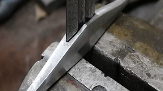 Forging  a Damascus sword part 3, making the crossguard and pommel.