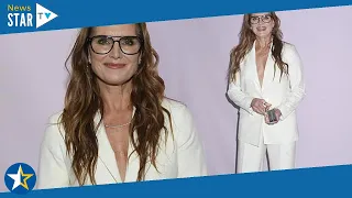 Brooke Shields cuts a stylish figure in a plunging white blazer as she attends an art auction in NYC